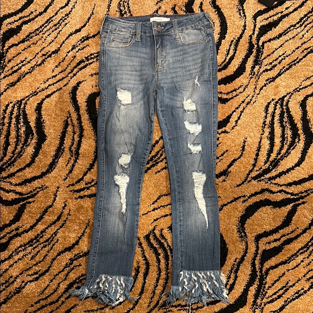 Distressed Blue Jeans with Frayed Hem